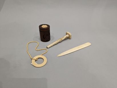Small set of objects in marine ivory: handle...