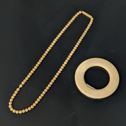 Small set of objects in marine ivory: handle...