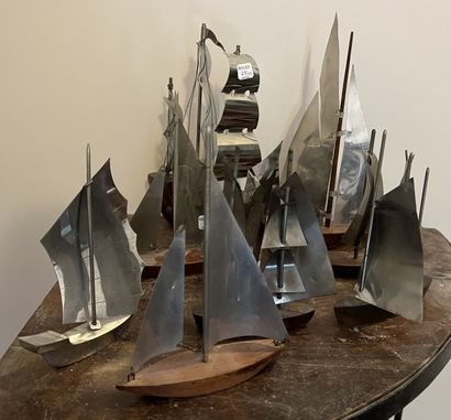 Nine small sculptures of sailing ships, the...