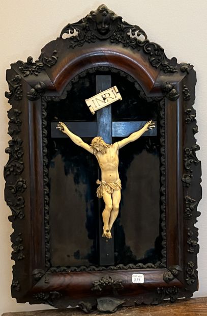 Christ in carved bone in a rosewood frame...