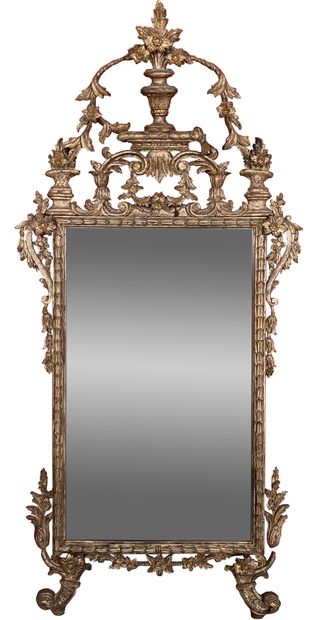 Miroir à entourage en bois doré et patine...