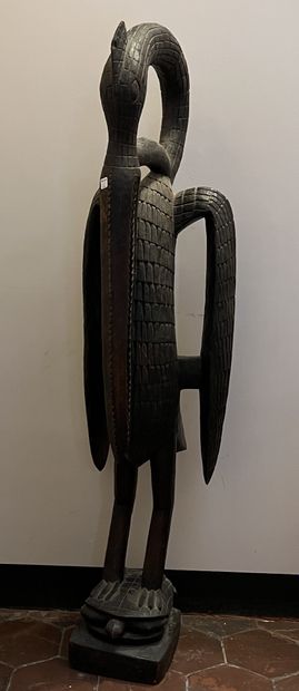 Large sculpture in natural wood representing...