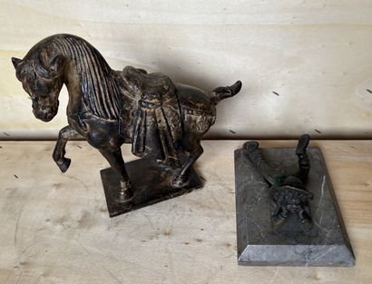 Paperweight with a young boy lying down in...