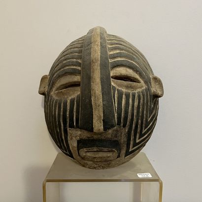 African mask in carved and painted wood,...