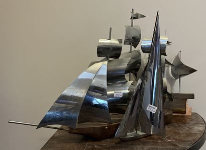 Six sculptures of sailing ships, the sails...