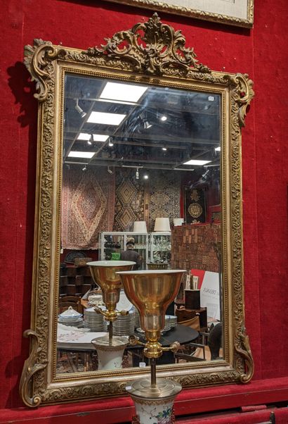 Miroir à entourage en bois doré et argenté,...