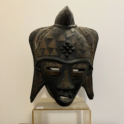 African mask in carved and patinated wood,...