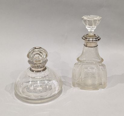 Two crystal bottles, one with flattened and...