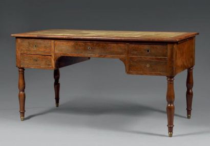 Bureau plat en placage d'acajou moiré. La...