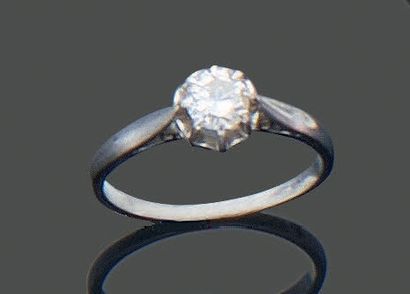 Platinum ring set with a modern-cut diamond,...