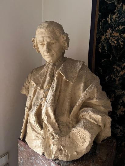 Male bust in painted plaster with terracotta...