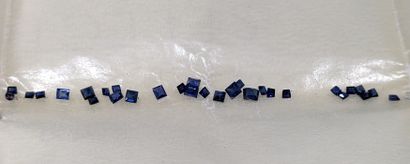 Set of unmounted colored stones: small emeralds;...