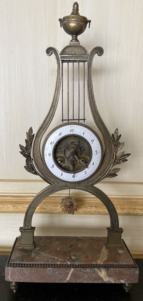 Bronze skeleton clock with white enamelled...