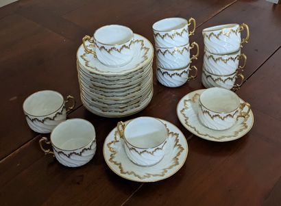 White porcelain tea service with gilded wave...