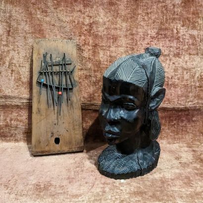 Tête d'africaine en palissandre sculpté....