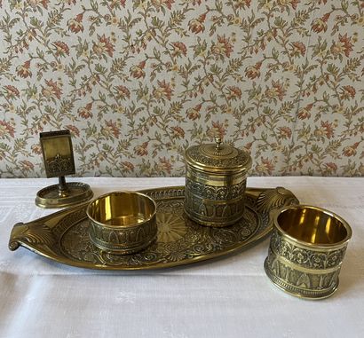 Brass smoker's set decorated with friezes...