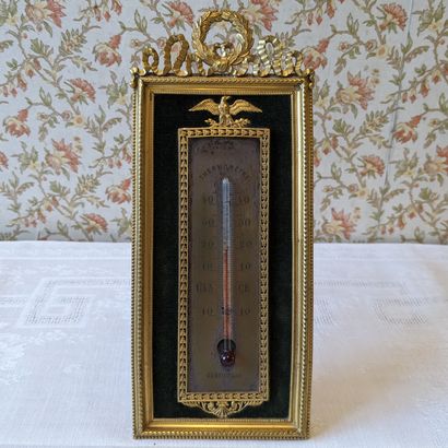 Gilt bronze barometer-thermometer decorated...