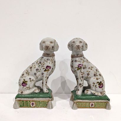 Pair of ceramic seated dog statuettes with...