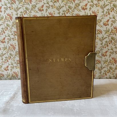 Stamp album, bound in grooved leather, top...