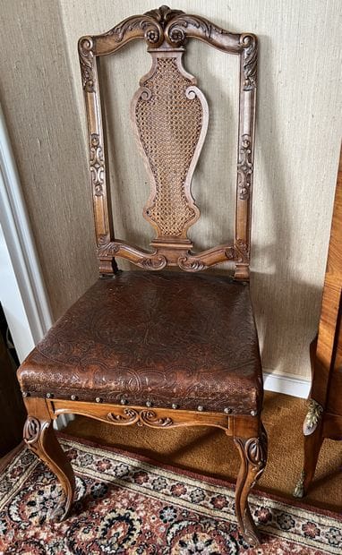 Suite of six walnut chairs carved with scrolls,...