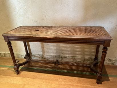 Natural wood bench, fluted legs joined by...