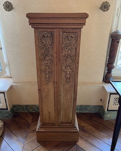 Sheath in light oak, each side carved with...