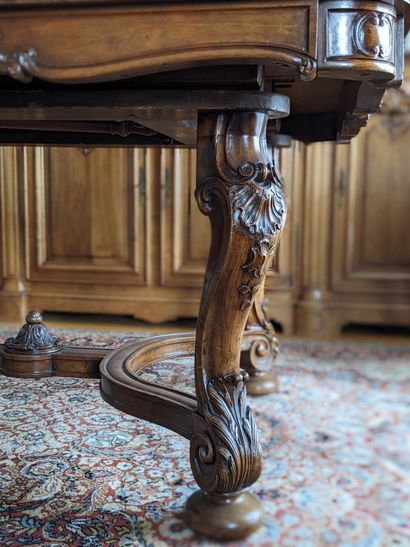 Large walnut table carved with shells, stylized...