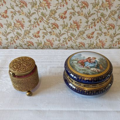Porcelain box with gilded decoration on a...