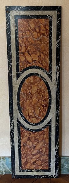 Sheath in light oak, each side carved with...