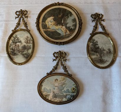 Set of gilded brass frames: a pair of oval-shaped...