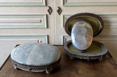 Pair of oval-shaped foot stools forming a...