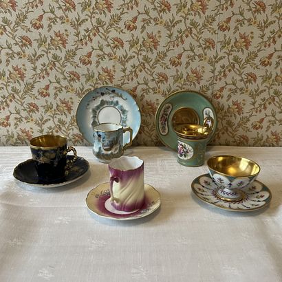 Set of five collectible porcelain cups, one...