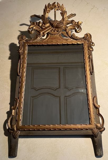 Mirror with patinated and gilded wood surround,...