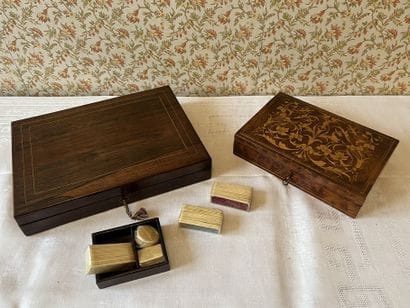 Rosewood game box inlaid with light wood...