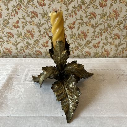 Bronze torch with chased leaves and golden...