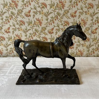 Stallion statuette in patinated bronze. H....