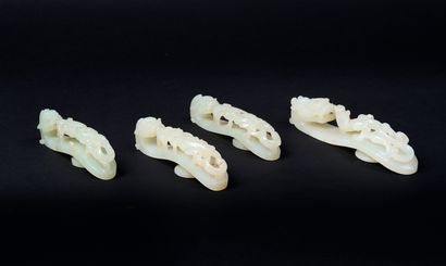 CHINE - XIXe siècle. Quatre fibules en jade...