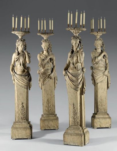 Suite de quatre termes porte-torchère en...