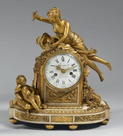 Pendule en marbre blanc et bronze doré représentant...