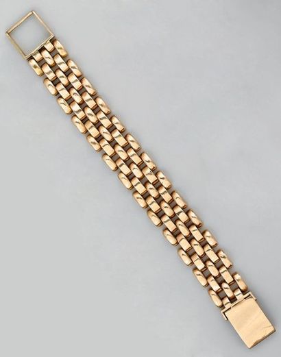 Bracelet souple en or jaune à maille vannerie...