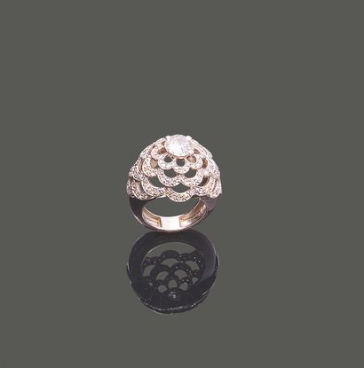 Dome-shaped platinum ring adorned in the...