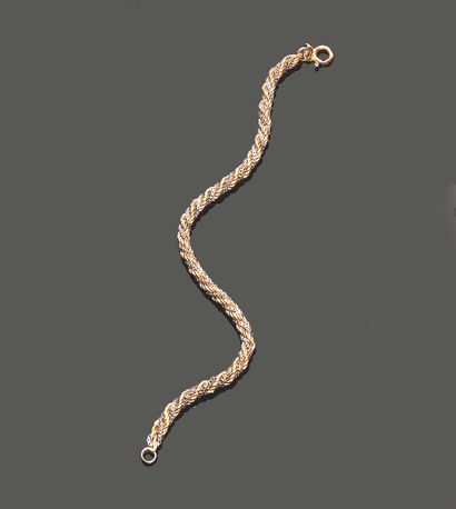 Petit bracelet en or jaune et or gris 18K...