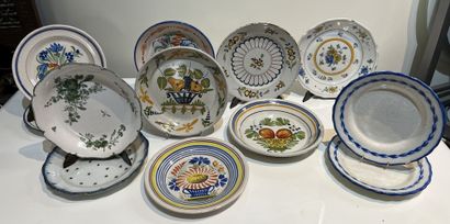 Set of twelve earthenware plates of various...