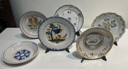 Set of seven earthenware plates of various...