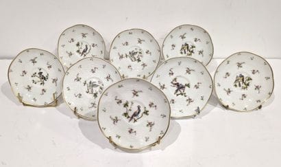 Suite of eight porcelain saucers decorated...