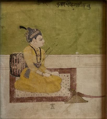 Indian miniature depicting a seated man with...