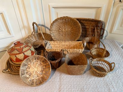 Basketry set including baskets. A green-tinted...
