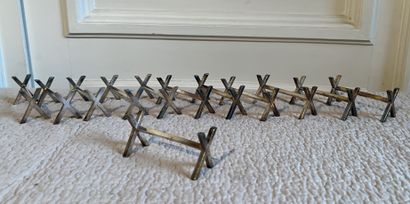 Suite of twelve silver-plated knife holders,...