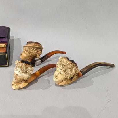 Set of three meerschaum pipes featuring women's...