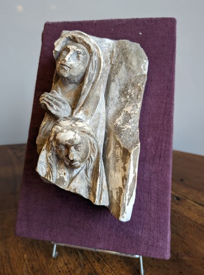 Carved stone element depicting the Virgin...